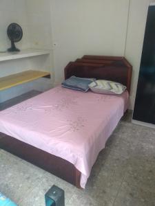 Uma cama ou camas num quarto em Pousada Santa Felicidade Trieste D