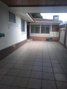 an empty patio in front of a house at Pousada Santa Felicidade Trieste D in Curitiba