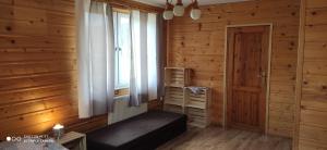 Postel nebo postele na pokoji v ubytování K85 Komańcza Baza Noclegowa Wypadowa Bieszczady Beskid Niski