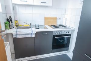 Kuchyň nebo kuchyňský kout v ubytování FULL HOUSE Studios - KornhausSupreme Apartment - Balkon, WiFi