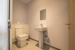 a bathroom with a toilet and a sink at No 8 Ocean Cabins - Saundersfoot Harbour - Saundersfoot in Saundersfoot