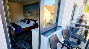 Postel nebo postele na pokoji v ubytování Hotel Viktória + 37 fotografií
