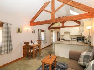 a living room with a couch and a table at Shepherds Retreat in Ashbourne