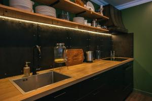 Kuchyň nebo kuchyňský kout v ubytování Andano.Loft + 30 fotografií