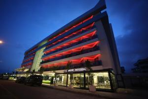 a large building with red lights in front of it at Sunprime C-Lounge - Adult Only in Alanya