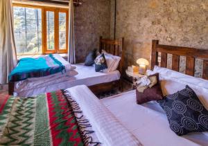 Tempat tidur dalam kamar di Barei Jungle Lodge