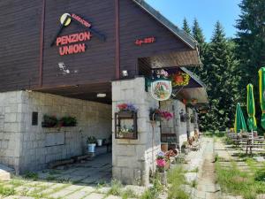 a building with a sign that reads pizza union at Penzion Union Harrachov in Harrachov