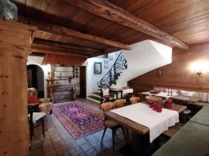 a dining room with a table and chairs at Haus Alexandra in Finkenberg