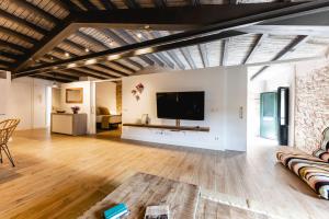 Televízia a/alebo spoločenská miestnosť v ubytovaní Bravissimo Plaça del Vi, Design Penthouse