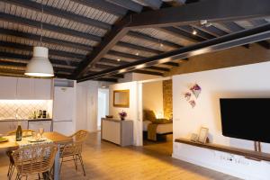 Televízia a/alebo spoločenská miestnosť v ubytovaní Bravissimo Plaça del Vi, Design Penthouse