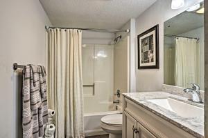 a bathroom with a sink and a toilet and a shower at Riverside Condo 2 Miles to Smoky Mtns Ntl Park! in Townsend +20 photos