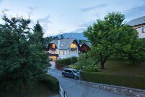 a car parked in front of a house at Guesthause Pr' Jozef in Bled