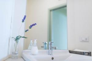 Koupelna v ubytování Aromi Piccolo Hotel