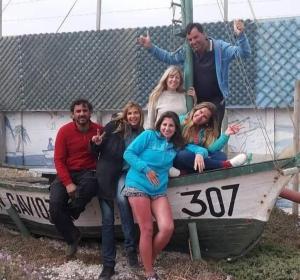 a group of people sitting on a boat at Cabañas Juan Gaviota in Punta de Choros