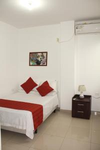 Ein Bett oder Betten in einem Zimmer der Unterkunft Departamentos de 2 y 3 Habitaciones en el Centro de MANTA
