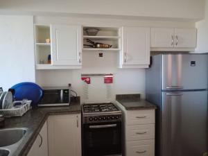 Kuchyň nebo kuchyňský kout v ubytování Apartment Marassi