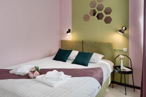 Un pat sau paturi într-o cameră la K2 Hotel St Petersburg