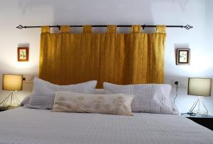 A bed or beds in a room at El Barranquillo
