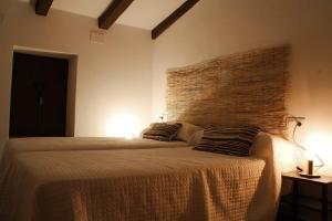 A bed or beds in a room at El Barranquillo