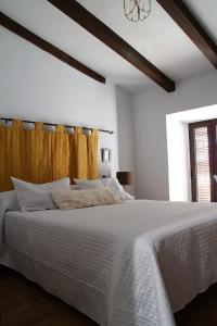 A bed or beds in a room at El Barranquillo