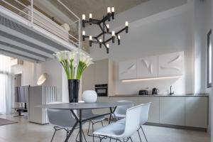 A kitchen or kitchenette at Fornace Loft with Dependance R&R