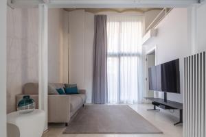 A television and/or entertainment centre at Fornace Loft with Dependance R&R