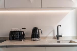 A kitchen or kitchenette at Fornace Loft with Dependance R&R