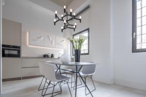 A kitchen or kitchenette at Fornace Loft with Dependance R&R