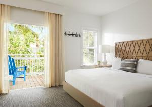 Giường trong phòng chung tại Parrot Key Hotel & Villas