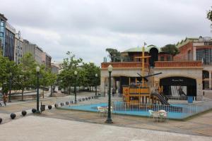 a playground in a city with a slide at Ninho Citadino Aveiro in Aveiro