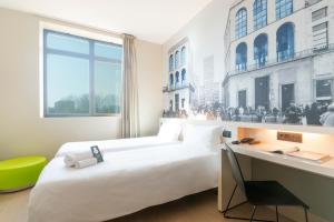 a bedroom with a bed and a window at B&B Hotel Milano San Siro in Milan