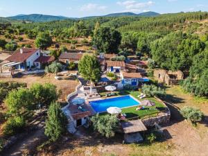 an aerial view of a villa with a swimming pool at Moinho do Maneio in Penamacor