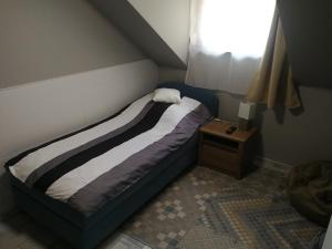 Postel nebo postele na pokoji v ubytování Érsek Apartman Eger