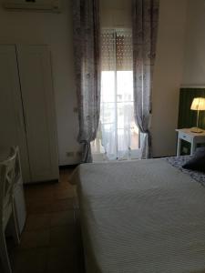 Postel nebo postele na pokoji v ubytování B&B Salvatore Lido di Noto + 23 fotografií