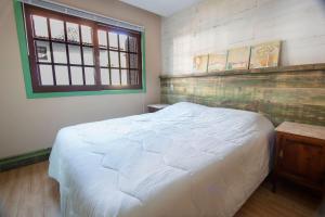 Llit o llits en una habitació de Morada do Lago - My Home Temporada