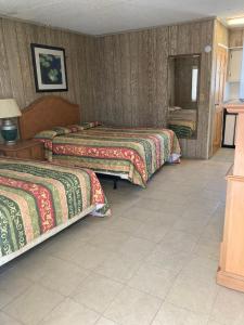 Postel nebo postele na pokoji v ubytování Glendale Motel + 6 fotografií