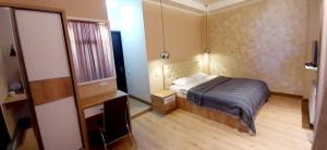 Postel nebo postele na pokoji v ubytování Happy Stay Hotel