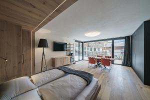 TV a/nebo společenská místnost v ubytování Atelier Garni Astei