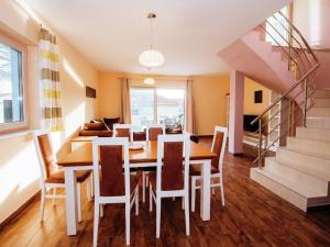 a dining room with a table and chairs at Vacation Home Between the Waters in Pakoštane