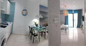 a kitchen and dining room with a table and chairs at Ocean house & perfect for you in Adeje