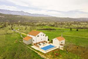 an aerial view of a house with a swimming pool at Nerona in Bisko