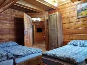 Posteľ alebo postele v izbe v ubytovaní uDany Villa Apartament