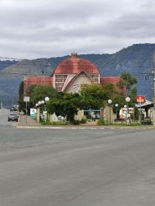 a building with a red dome on top of it at pousada alternativa dora in Urubici