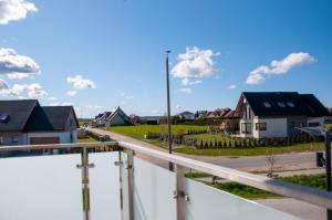 a street in a suburb with houses at JGJ Ostoja in Puck