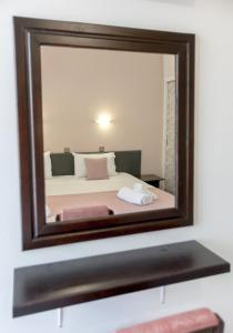A bed or beds in a room at Hotel Electra