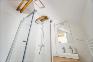 a bathroom with a shower and a sink at Rya Residence Oradea in Oradea +53 photos