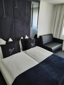 Łóżko lub łóżka w pokoju w obiekcie The Place Boutique & Design Hotel Flachau