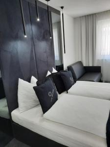 Łóżko lub łóżka w pokoju w obiekcie The Place Boutique & Design Hotel Flachau