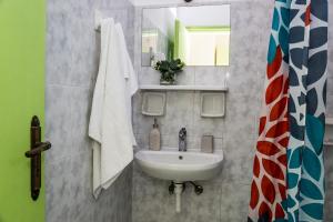 a bathroom with a sink and a mirror at Anemomylos Studios Alykanas in Alikanas