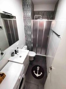 a bathroom with a shower and a toilet and a sink at Holiday Apartment Mariola in Calpe